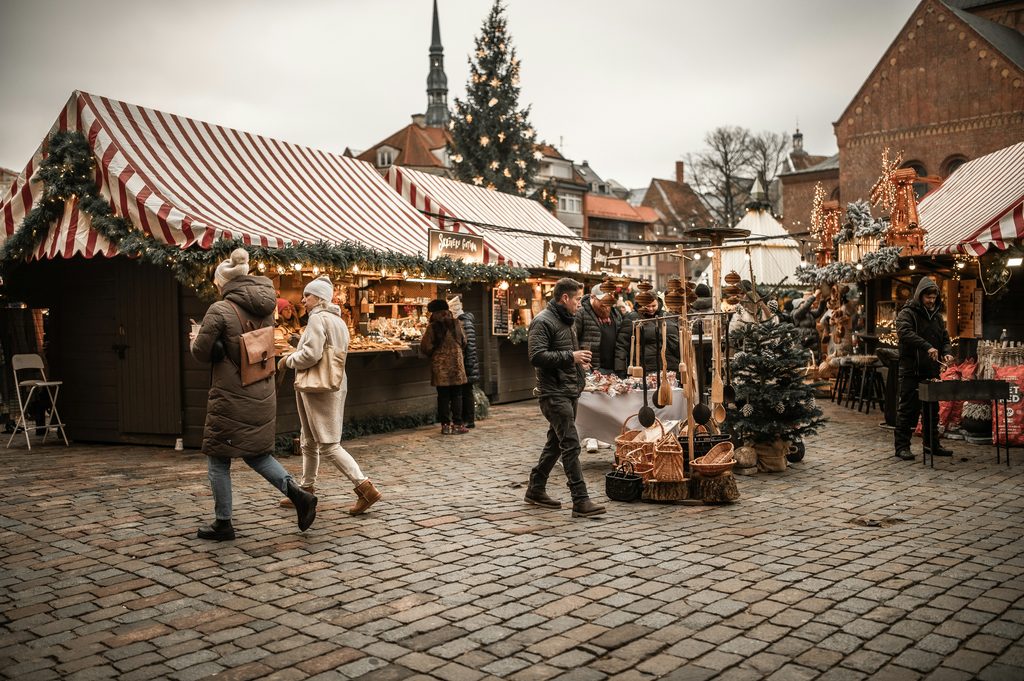 Riga Old Town Christmas market with wooden stalls and Christmas tree