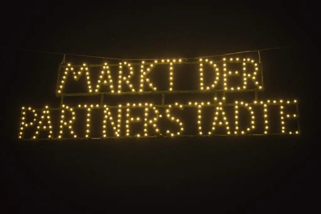 Markt der Partnerstädte sign lit up at Nuremberg Christmas market