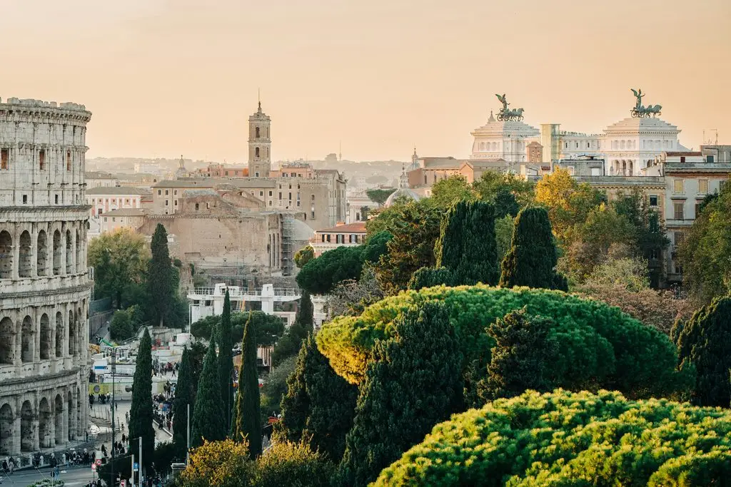 Week-long spring break destinations in Europe: Rome's Colosseum and the Victor Emmanuel II Monument at sunset.