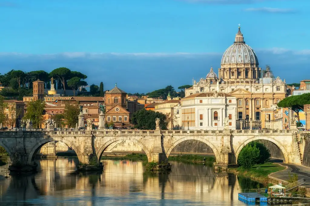 Spring break in Rome: St. Peter's Basilica dome rises over Ponte Sant'Angelo and the Tiber River.
